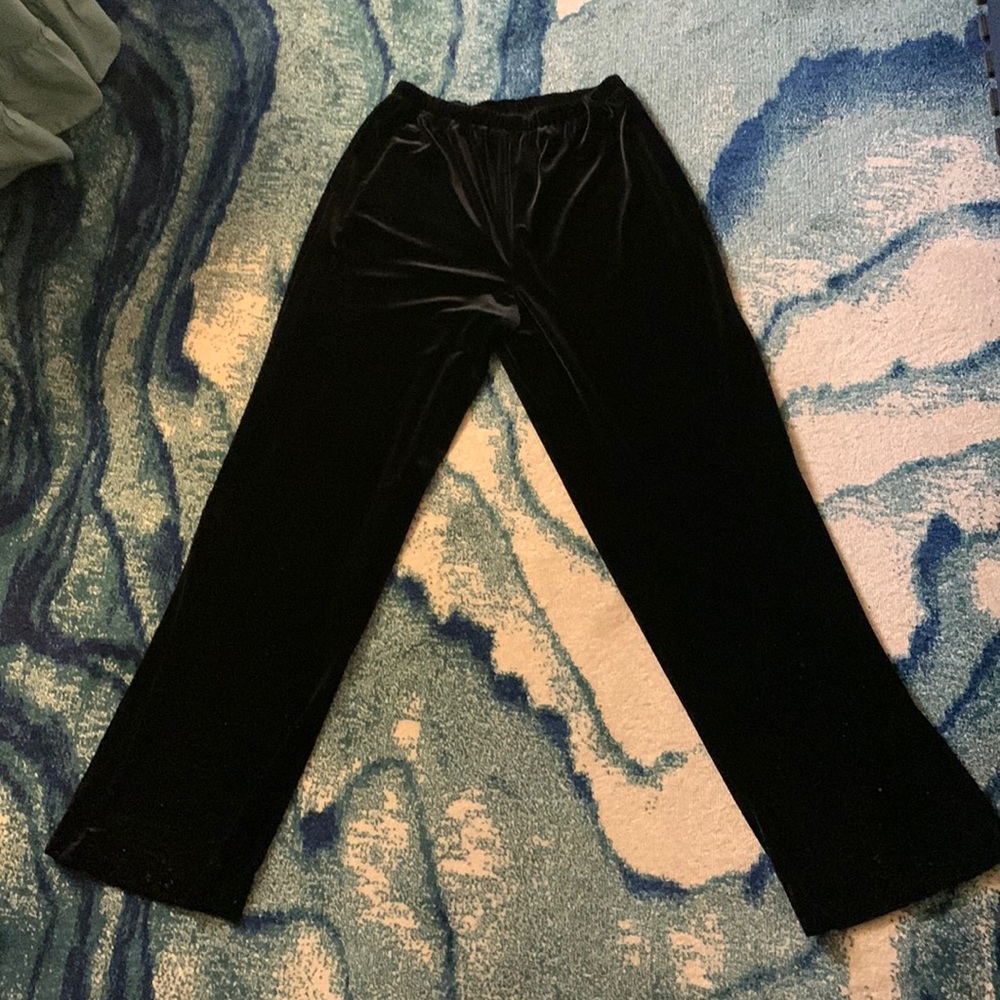 Black “velvet like” pants.